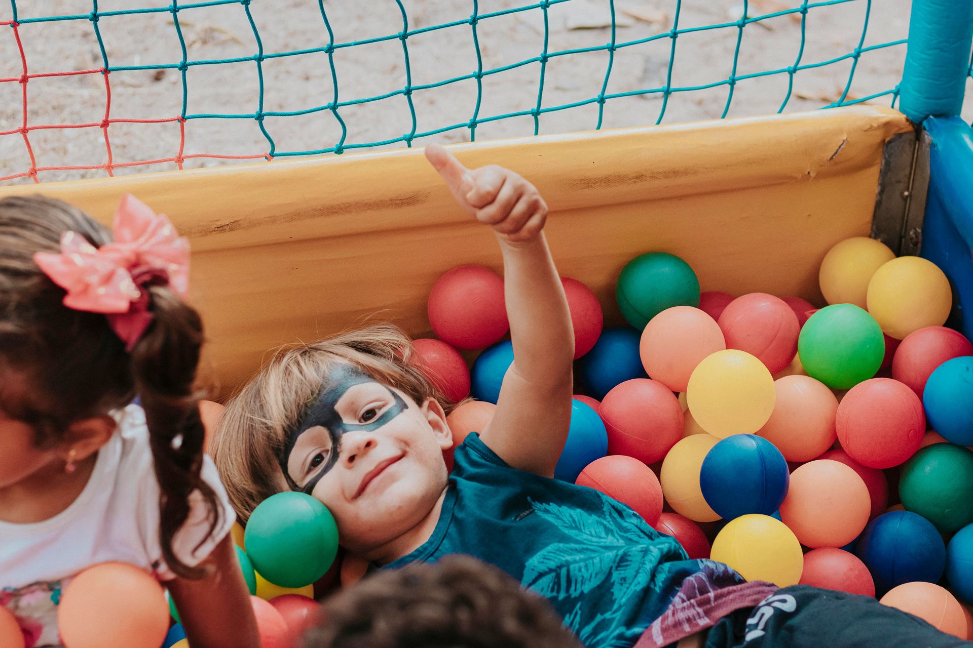 little boy in ball pit